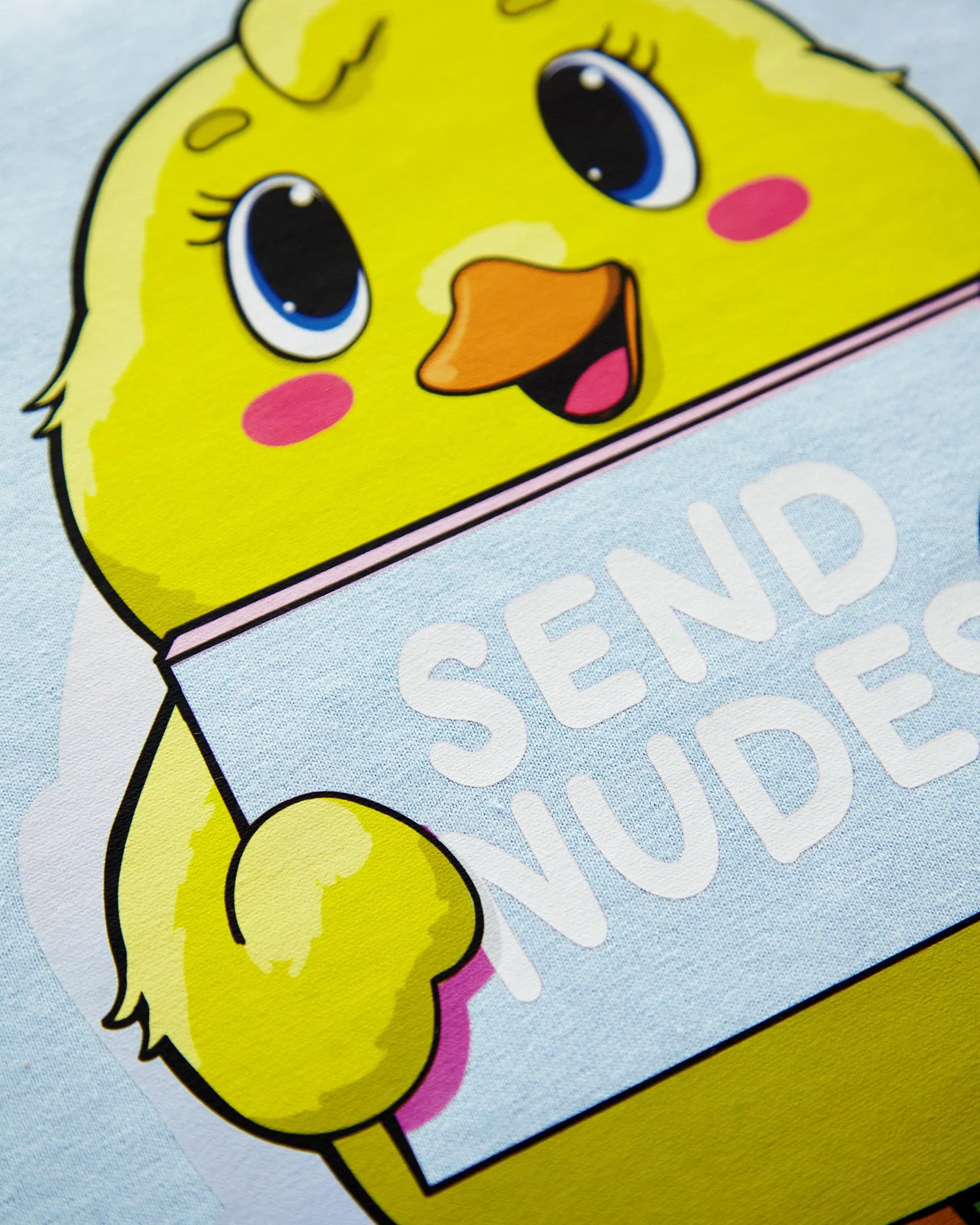 Cheeky duck, holding a sign on blue - mens cropped tee.